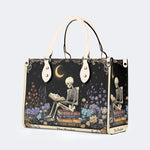 Skeleton Reading A Book Among Flowers - Leather Handbag