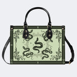 Inscribed Viper Print - Leather Handbag