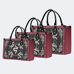 Inscribed Viper Print - Leather Handbag