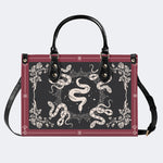 Inscribed Viper Print - Leather Handbag
