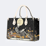 Skeleton Reading A Book Among Flowers - Leather Handbag