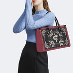 Inscribed Viper Print - Leather Handbag
