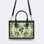 Inscribed Viper Print - Leather Handbag